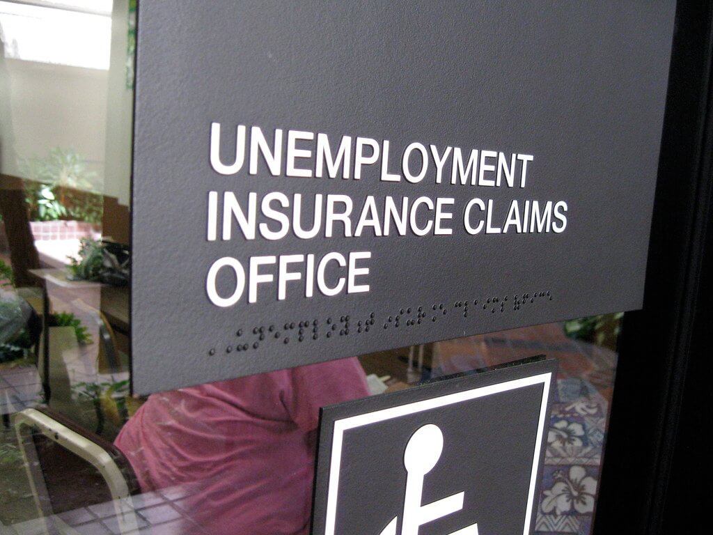 Unemployment Resources for COVID-19 include visits to DES offices with signs that read "unemployment insurance claims office"